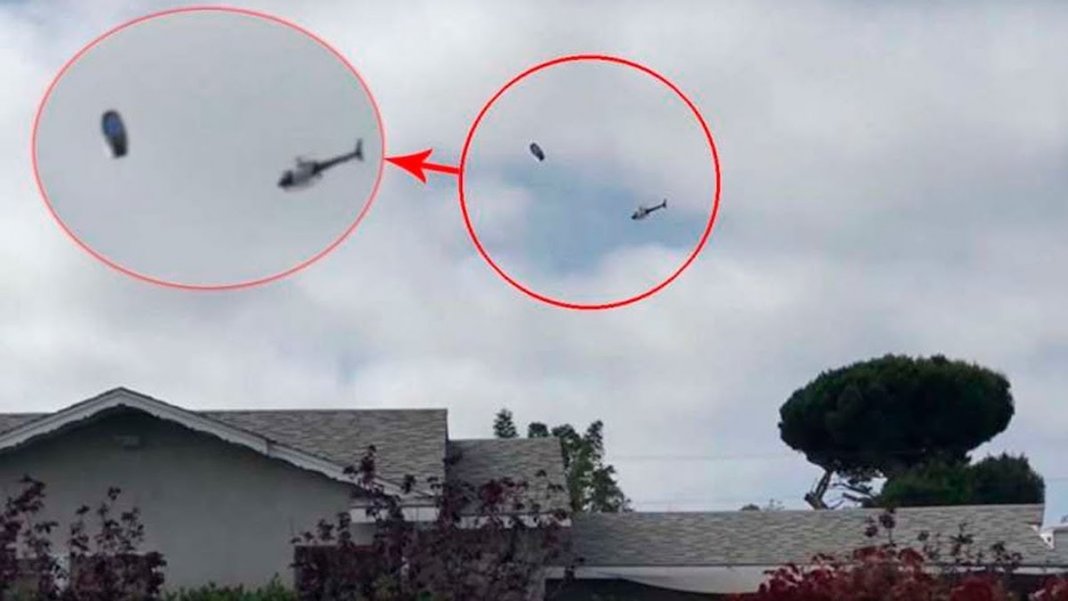 Helicóptero é filmado a rondar um objecto voador estranho